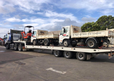 Large Tilt tray truck transporting three vehicles in Adelaide